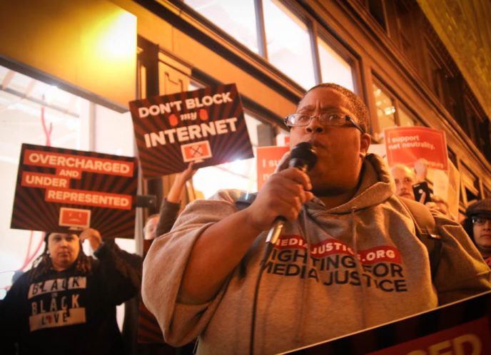 Malkia leads a rally for net neutrality in Oakland