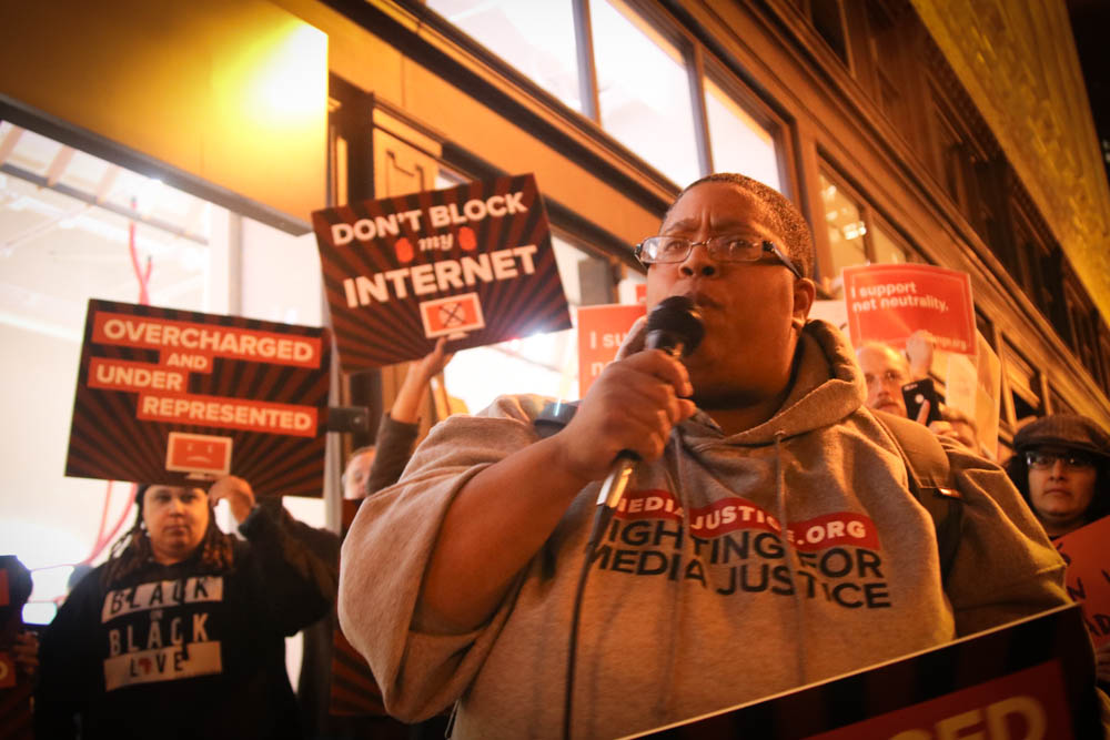 Malkia leads a rally for net neutrality in Oakland